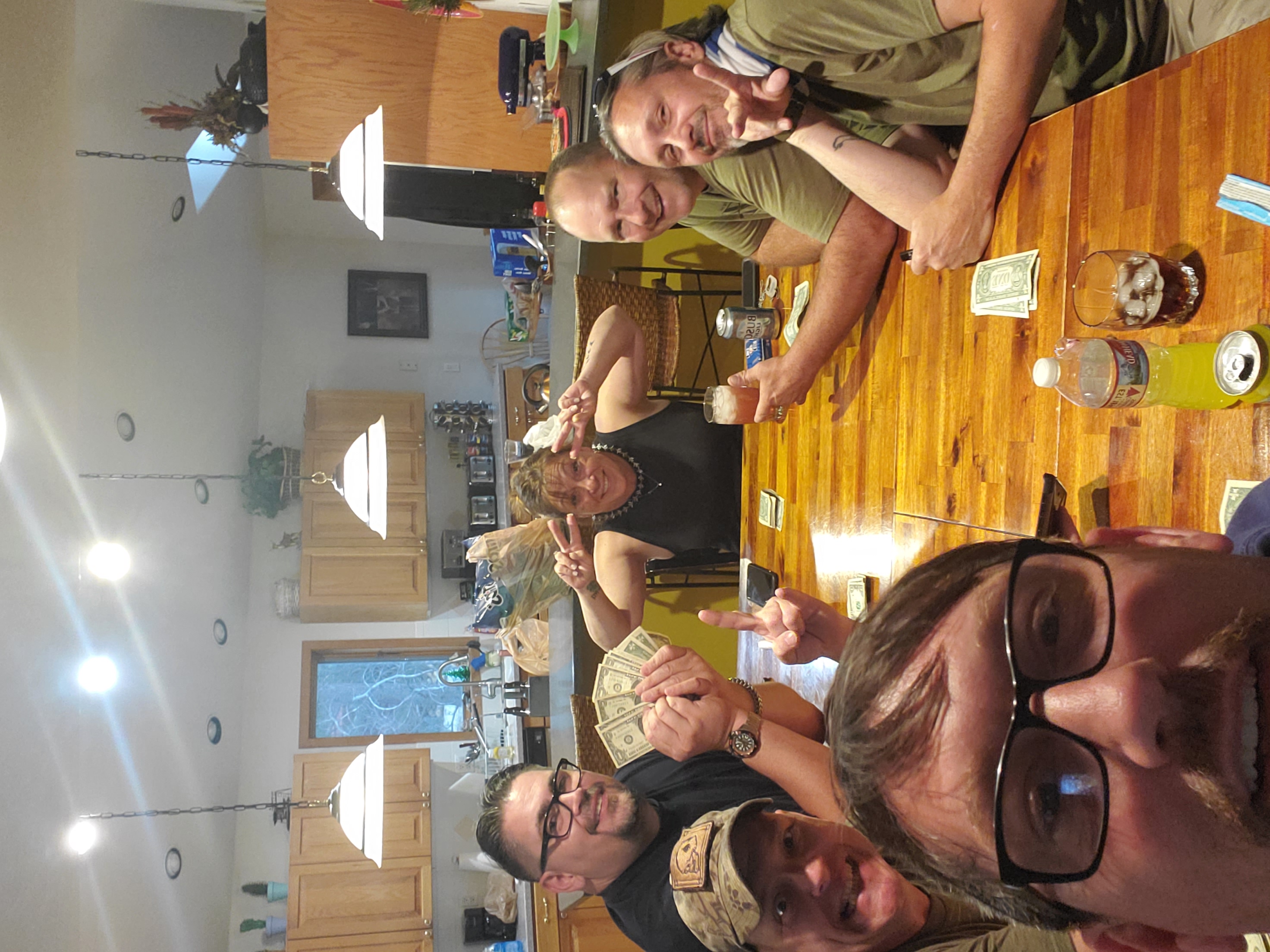 Friends gathered around a table playing LRC in Colorado