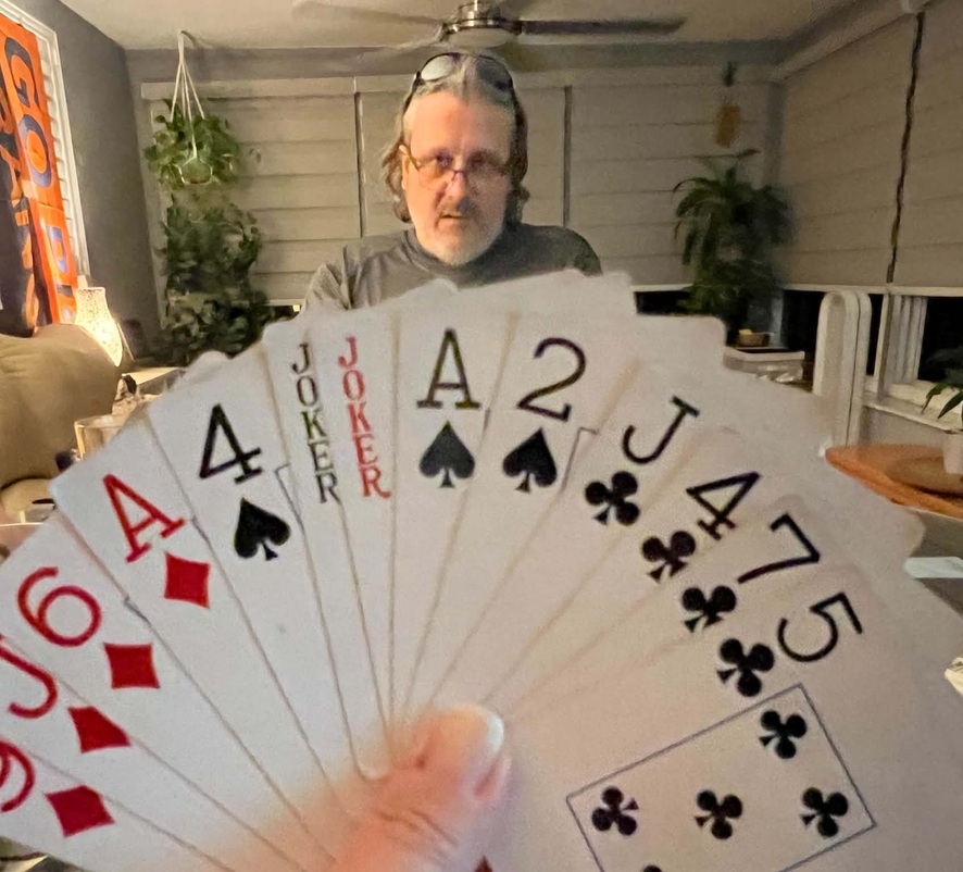 A Grunt Spades hand showing both Jokers, the Ace and Deuce of Spades, and remaining cards